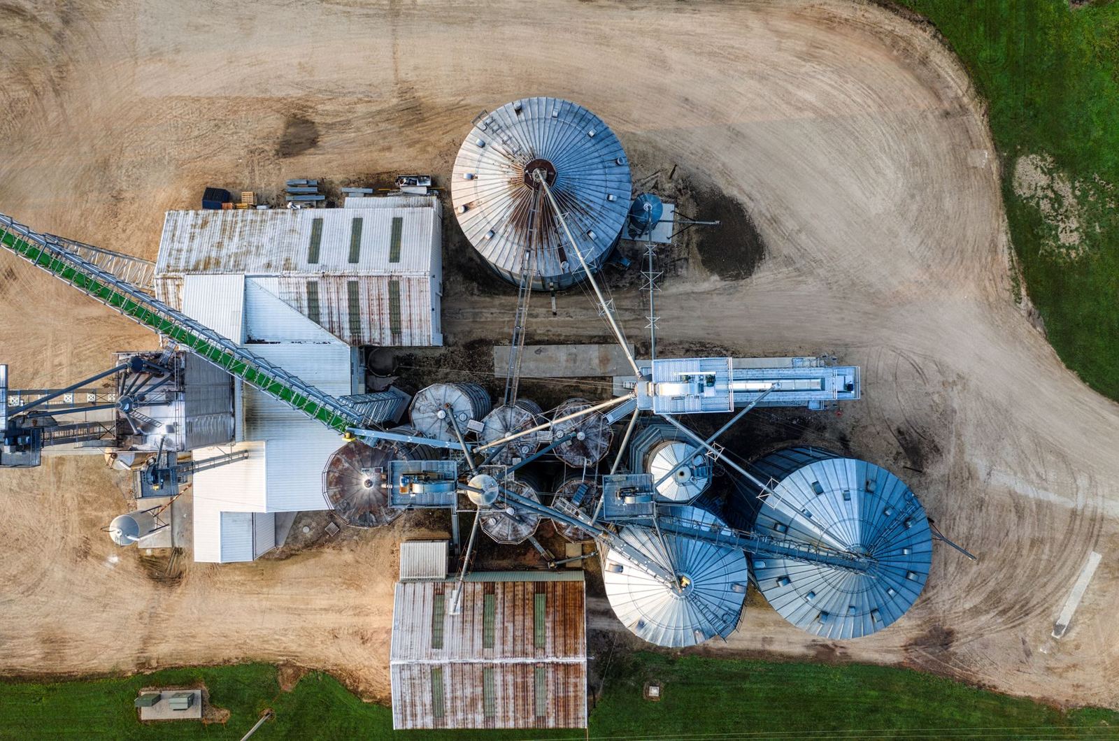 Drone shot capturing the top view of industrial silos and buildings in Utica, MN.